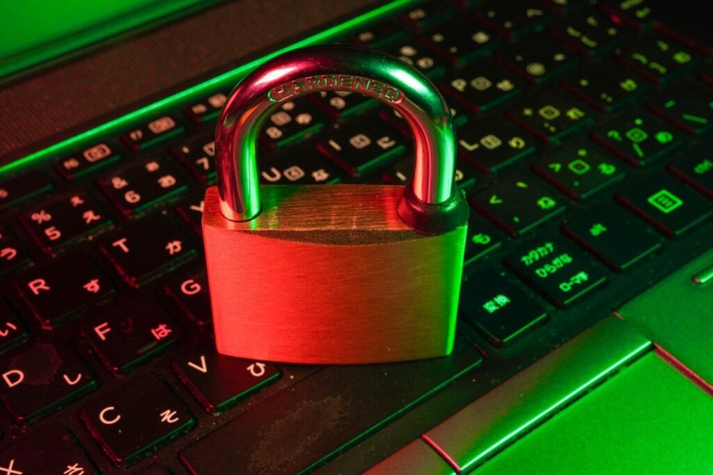 Red padlock on a black computer keyboard, illustrating cybersecurity threats in 2026